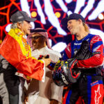 Carlos Sainz winner of the overall Car category shakes hands with Ricky Brabec winner of the overall bike category at the 2024 Dakar, image by Motul