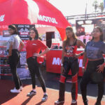 Models showcase the Motul merch at the Shop-in-Shop retail concept launch, image by Motul