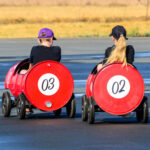 Kids enjoying the Motul pedal cars as they wait for their spin in the drift cars, photo by Marko Swart